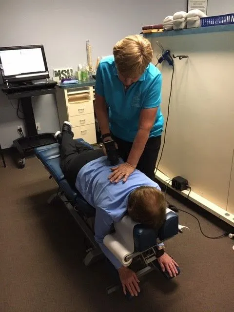 Dr. Kingen working with patient