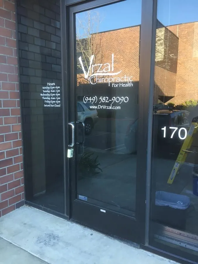 Brick and glass building with our front door facing the Berkshire Hathaway building