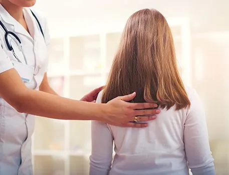 Chiropractor working with patient