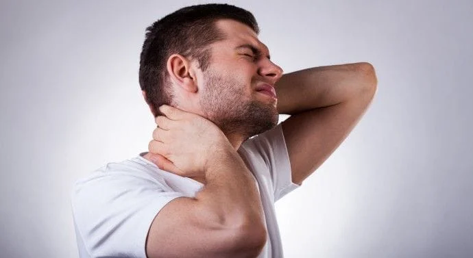 man with neck pain that can be treated by our chiropractor in West haven