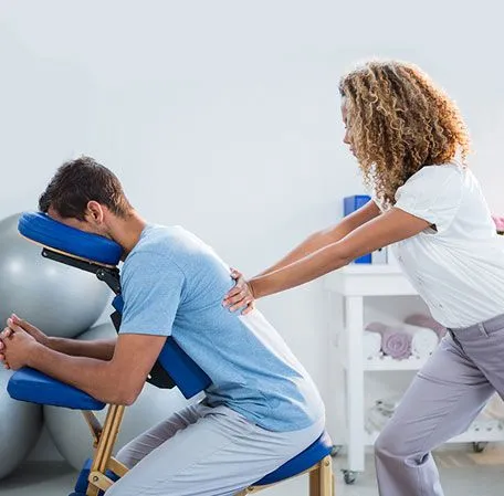 Chiropractor adjusting patient