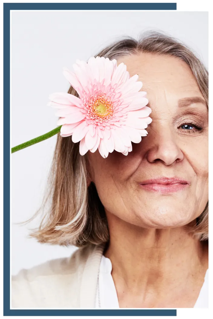 Smiling Mature Woman with Flower