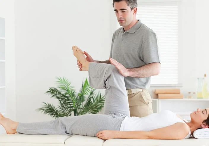 chiropractor helping a patient stretch