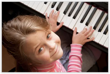 Image of child practicing piano