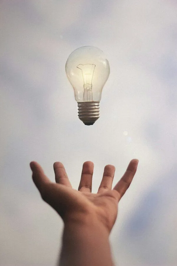 lightbulb in hand