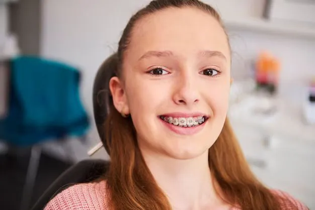 teen girl smiling showing braces Melrose orthodontist