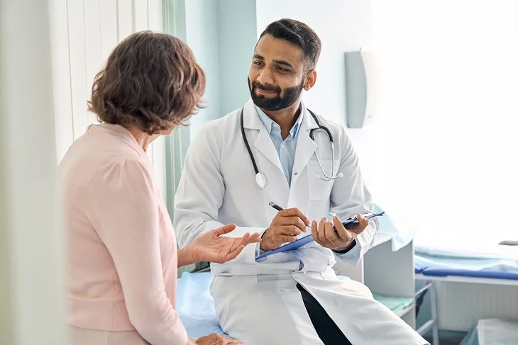 Doctor Assisting Patient