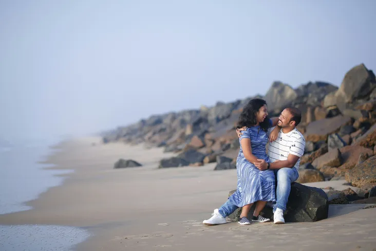 Person sitting in front of an audio mixer