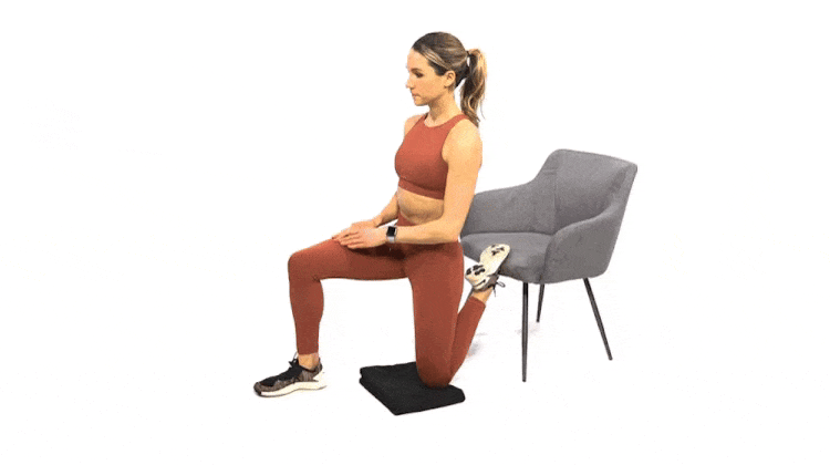 A woman doing the couch stretch.