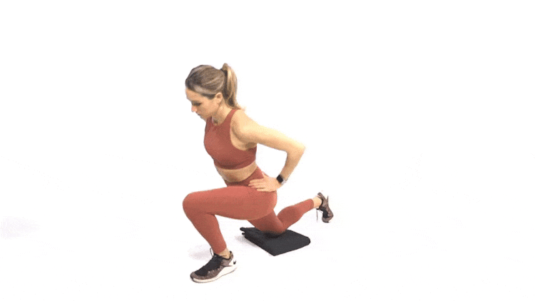 A woman doing a half-kneeling hip flexor stretch.