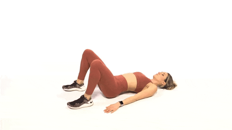 A woman performing glute bridges.