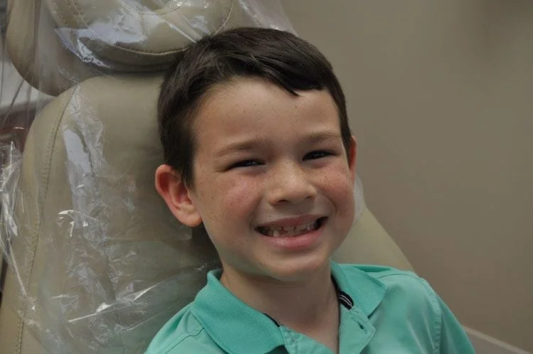 Boy in Dentist Chair Smiling