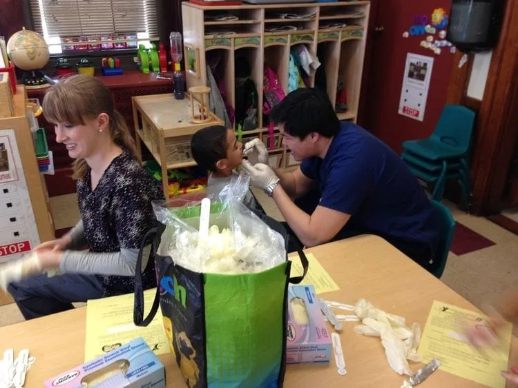 Dr. Jeffrey Pan doing kids' dental checkups in Melrose