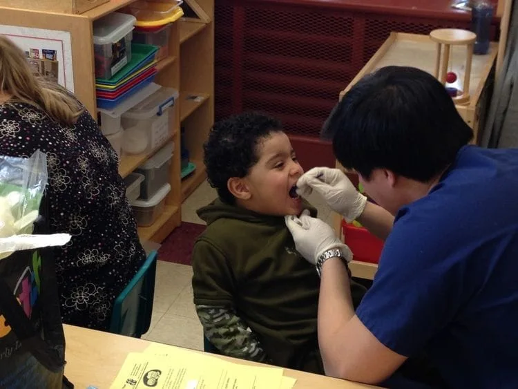 Dr. Jeffrey Pan doing kids' dental checkups in Melrose, MA