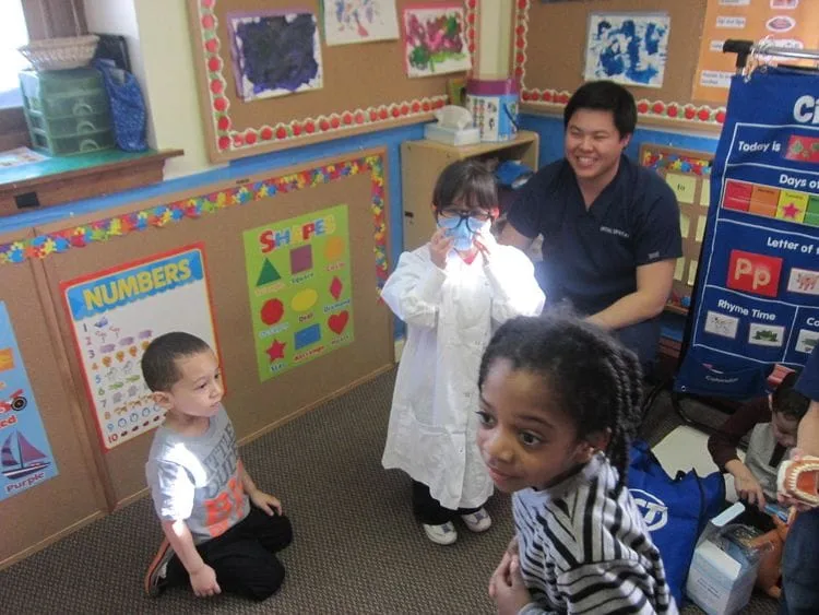 Dr. Jeffrey Pan doing children's dental checkups in Melrose