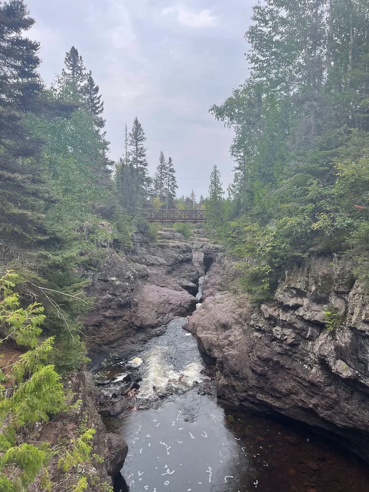 river with jagged rocks surrounding it