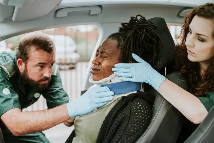 Auto accident victim being recued