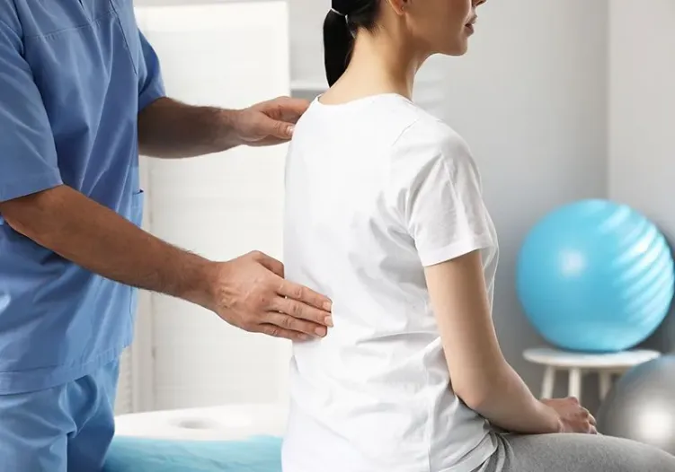 chiro exam on female patient