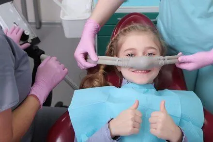 little girl at dentist wearing nitrous oxide mask, dentist Decatur, IL sedation dentistry