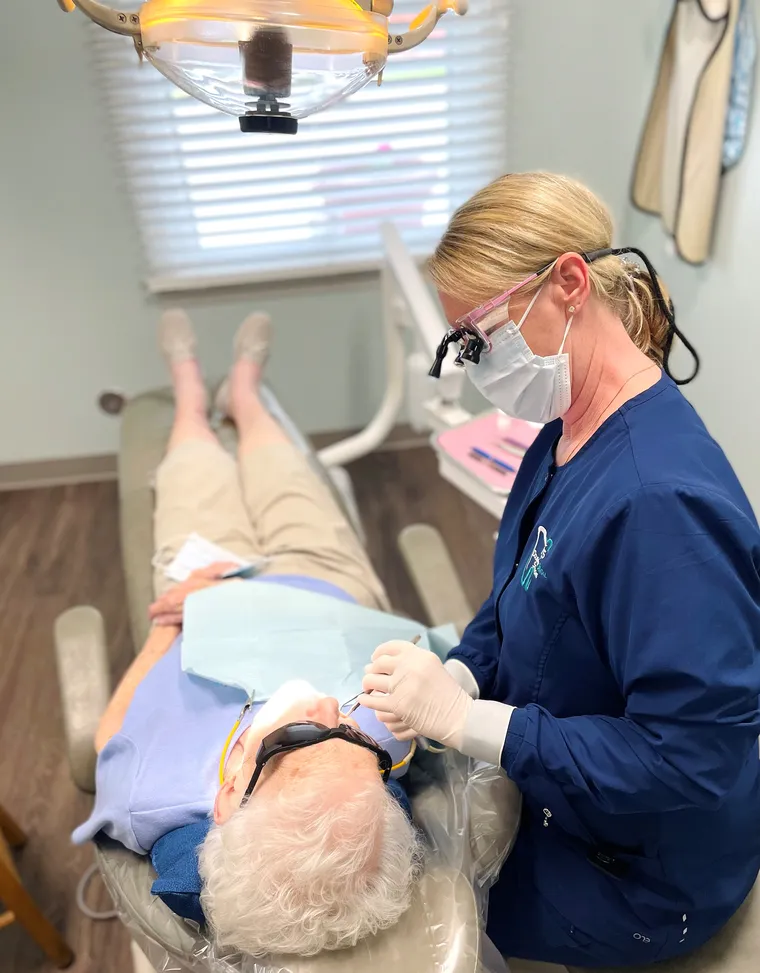 Dentist performing dental exam