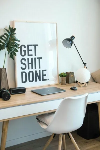 get shit done sign at desk