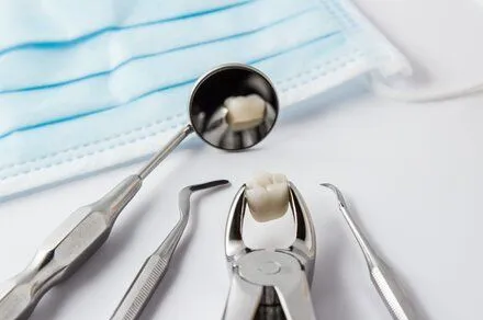 dental tools on counter with extracted tooth, dentist Leesburg, VA