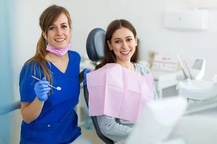 dental hygienist with female patient, general dentistry Montclair, NJ dentist
