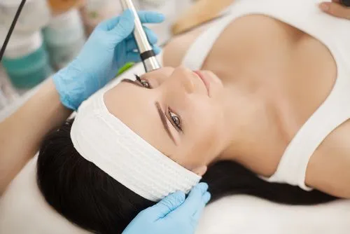 Patient undergoing Microcurrent therapy at a chiropractic office