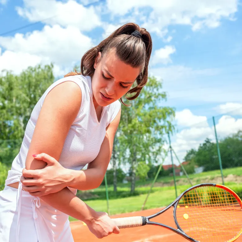woman holding her elbow