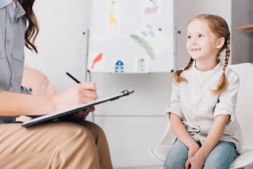 Child during a therapy session with a licensed therapist