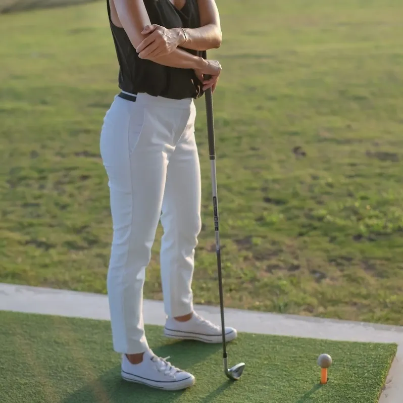 woman holding her elbow