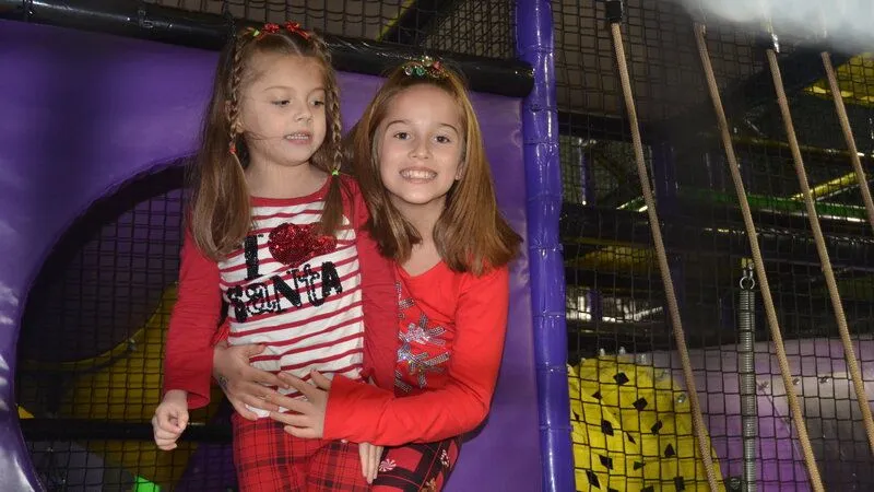 two children in red at an event