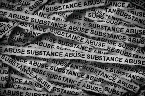 Black-and-white newspaper strips with the words “Substance Abuse”