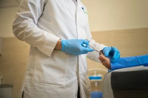 Medical professional performing toenail extraction