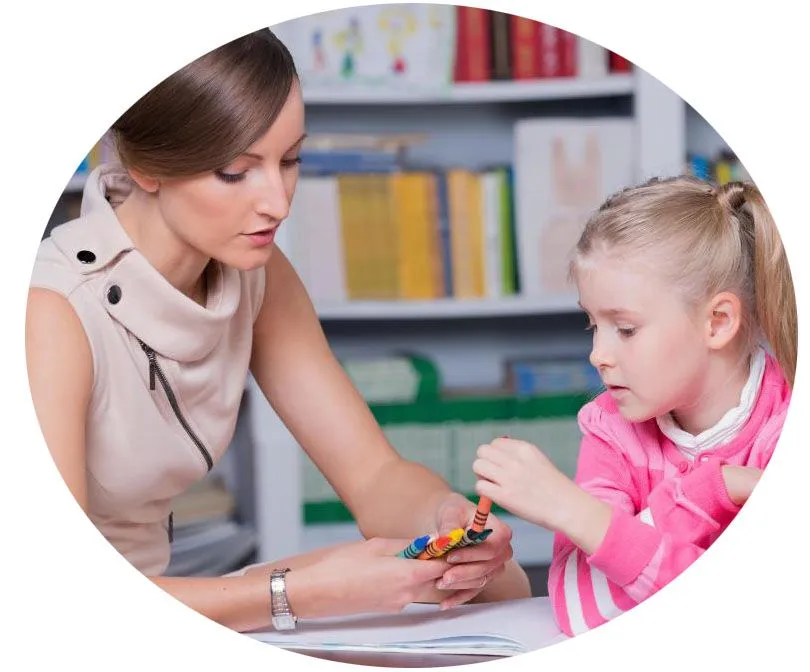 a woman and child during therapy session