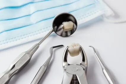 dental tools on counter and extracted tooth, dentist in Perry Hall Nottingham, MD