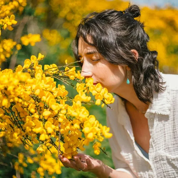 woman smelling flowers