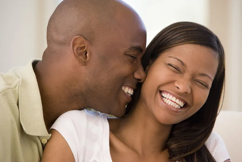 black man and woman smiling and laughing nice teeth, veneers Sachse, TX dentist