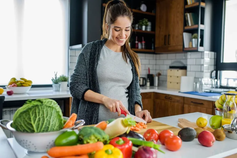 Woman Cutting Vegetables for Healthy Meal