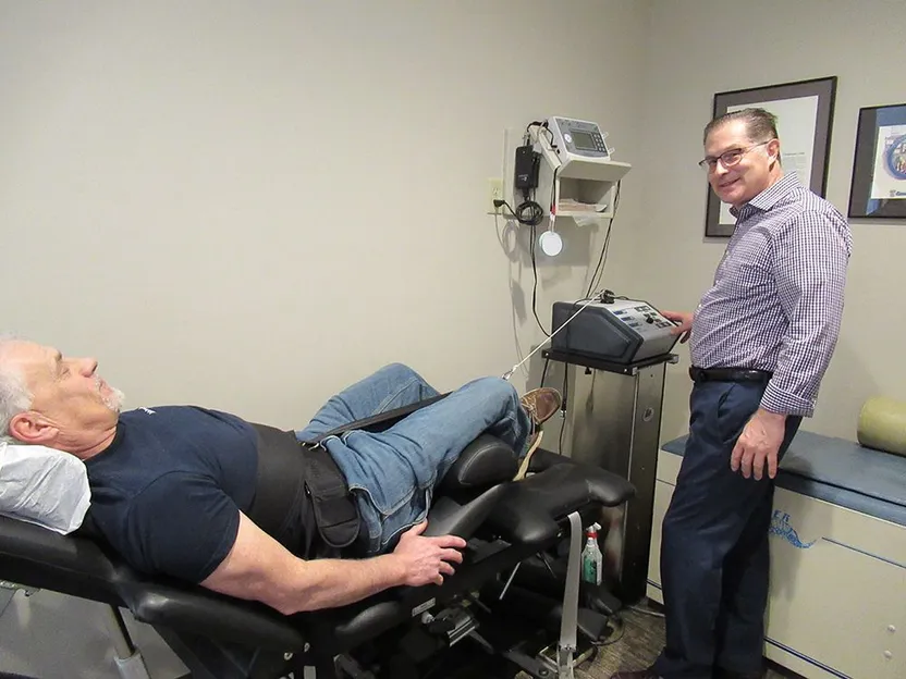 Dr. Pokowicz working with a patient