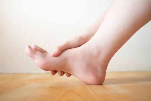 Foot tingling and numbness in woman caused by peripheral neuropathy