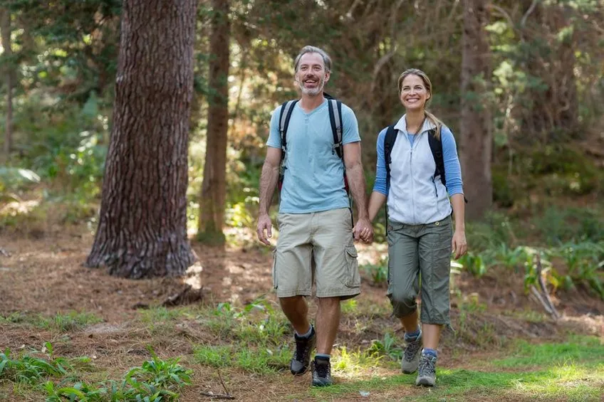 couple walking hand in hand and hiking