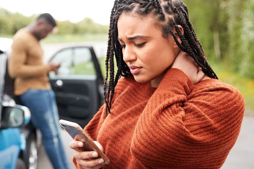 Physician evaluating car accident injury patient at Ma Kao Rehabilitation in Flushing Queens NY