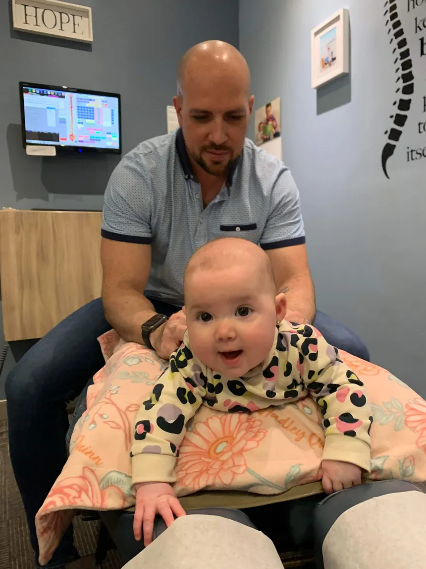 Gentle chiropractic adjustment for a newborn to support nervous system function and improve sleep and comfort