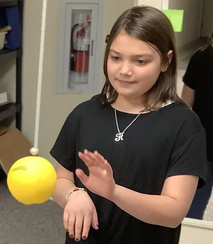 Girl tapping a ball