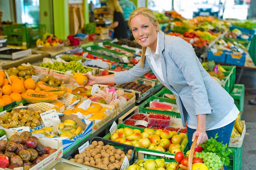 woman shopping for veggies and fruits