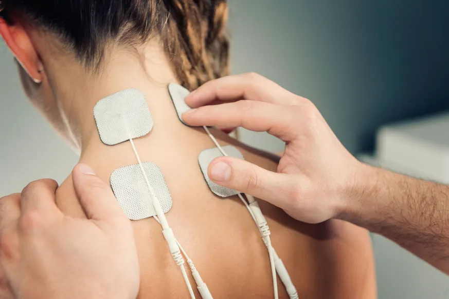 woman having muscle stim on neck