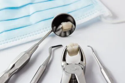 assortment of dental tools and extracted tooth on counter, general dentist Old Bridge, NJ 08857