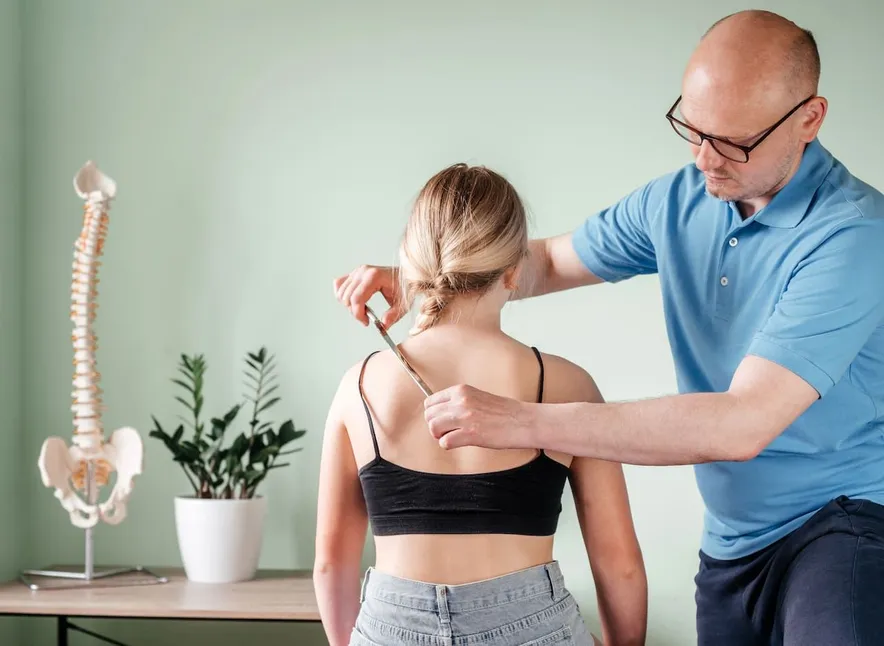 Chiropractor doing Soft Tissue Mobilization to the patient