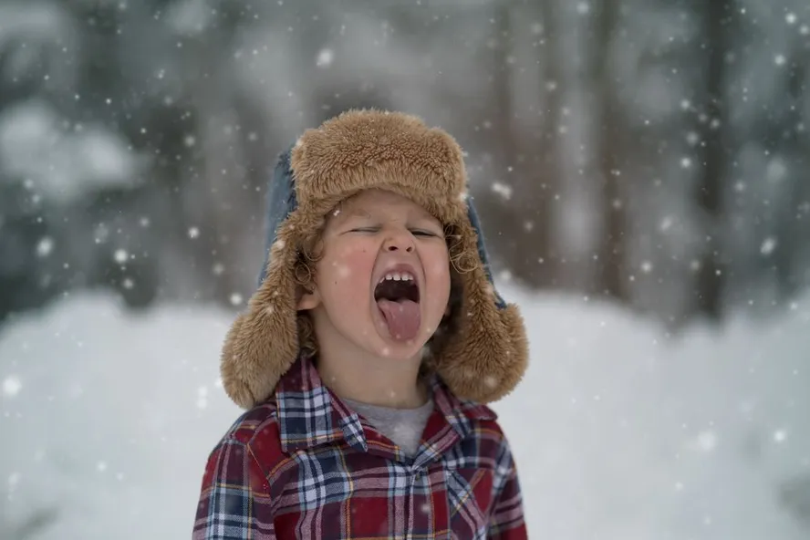 Child playing in snow
